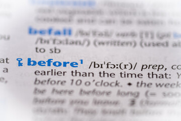 Before word in a dictionary. Selective focus, close up.