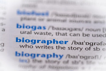 Biographer word in a dictionary. Selective focus, close up.