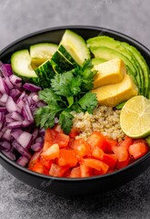 Fresh Quinoa Salad Bowl with Avocado, Cucumber, Tomato, and Cilantro on Gray Background