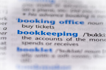 Bookkeeping word in a dictionary. Selective focus, close up.