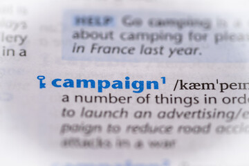 Campaign word in a dictionary. Selective focus, close up.