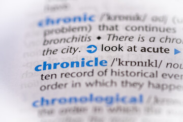 Chronicle word in a dictionary. Selective focus, close up.