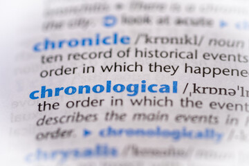 Chronological word in a dictionary. Selective focus, close up.
