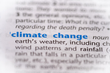 Climate change word in a dictionary. Selective focus, close up.