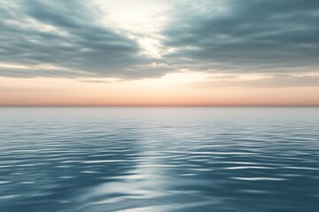 Obraz premium Brilliant pastel sky at the horizon creates a serene atmosphere over tranquil waters during dusk