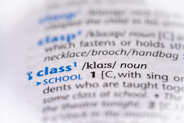 Class word in a dictionary. Selective focus, close up.