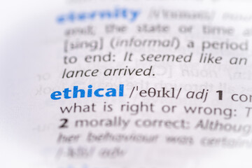 Ethical word in a dictionary. Selective focus, close up.