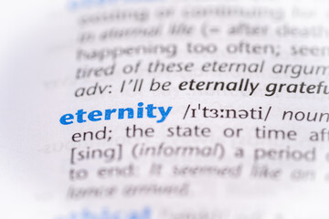Eternity word in a dictionary. Selective focus, close up.