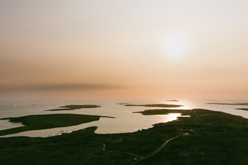 Sunset view of Ardmore and Turbot islands from famous scenic Sky Road, 15km looped drive starting...