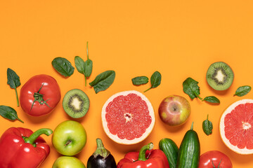 Fruits, vegetables on orange copy space background. Healthy food delivery background. Grocery supermarket and clean eating concept