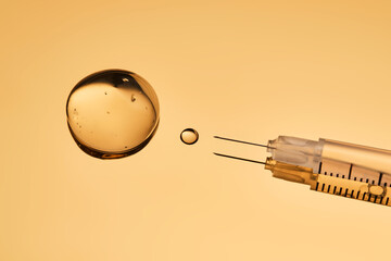 A drop of gel pours from a syringe for cosmetic procedures.