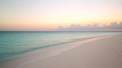 Obraz premium Tropical Beach with Soft Waves and Pastel Sunset Sky – Relaxing Coastal Landscape