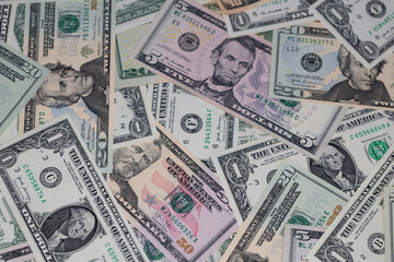 different US dollar banknotes background