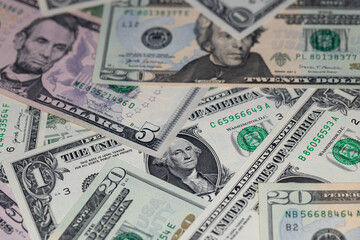 different US dollar banknotes background
