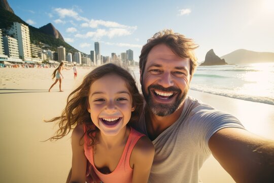 Father and daughter smiling and taking a selfie while enjoying summer vacation on ipanema beach in rio de janeiro, brazil
