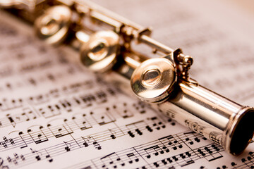 Fototapeta premium a flute on sheet music