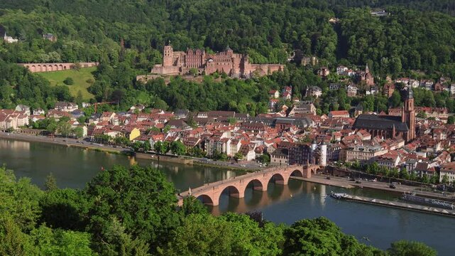 This panoramic view of Heidelberg, Germany, with the old bridge crossing the Neckar River from Philosophenweg.