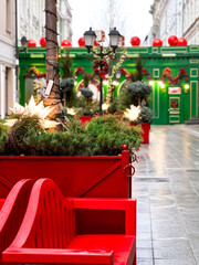 Christmas trees and green wooden decorations on the Moscow city street