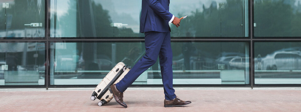 Unrecognizable Man With Bag And Suitcase Walking In Airport Terminal, Young Male On His Way To Flight Boarding Gate, Ready For Business Travel Or Vacation Journey, Cropped, Copy Space. High quality