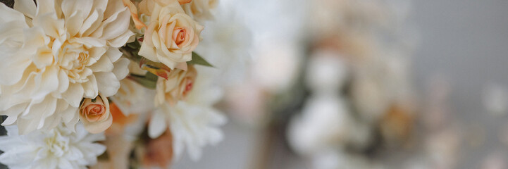 Wedding flower bouquet with white and fallen petals. Beauty and elegance concept. Invitation background with copy space. Banner with copy space.