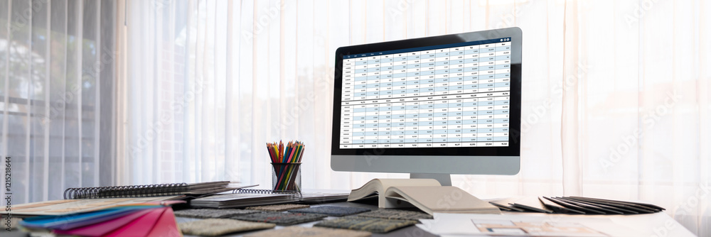 Poster accounting software on computer screen showing financial statement spreadsheets and account balance 
