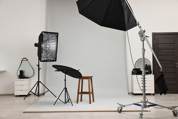 Professional lighting equipment setup in modern photo studio