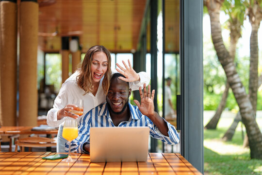 Diverse Entrepreneurs Video Chatting at Tropical Bar