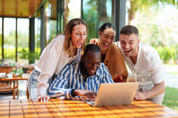 Cheerful Diverse Friends Sharing Laughter at Tropical Bar