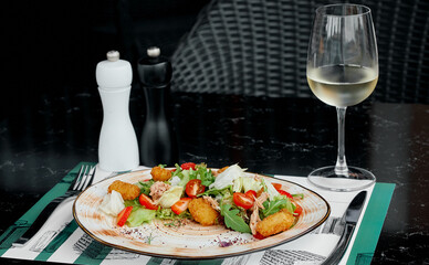Fresh Salad with Tuna and Crispy Croquettes Served with White Wine.