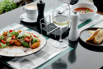 Fresh Salad with Cappuccino and Wine Glass.
