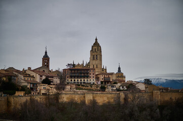 A stunning view of the city of Segovia, showcasing its historic wall and the majestic Cathedral, located in Castilla y León, Spain