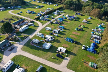 aerial view of a camping site, including tents, caravans and motorhomes
