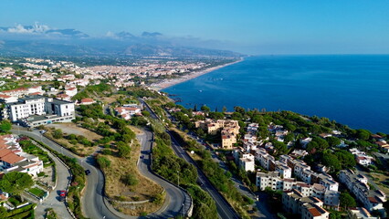 Scenographic aerial view of Calabria Cost with hypnotic blue color sea in summer time