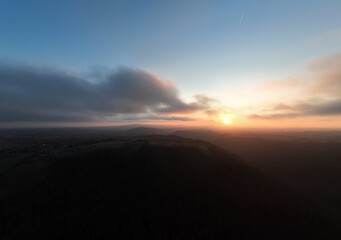 Moody sunset with haze over french landscape countryside   drone view