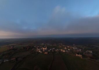 Moody sunset over french town centres countryside drone view