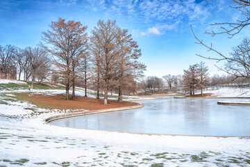 The Gateway Arch Trail, St. Louis, Missouri is beautiful in snow. The pond was frozen, trees are frosted. The trail connects to downtown St. Louis, and the harbor looking to Illinois, Clark County. 