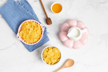 cornflakes  in a bowl on a light background, breakfast