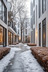 a walkway in front of a building with snow on the ground