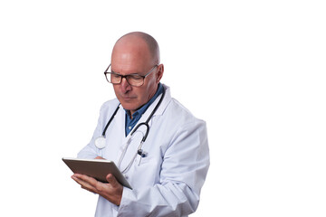 A medical professional in a white coat checks a tablet for patient details in a well-lit healthcare setting during daytime hours.
