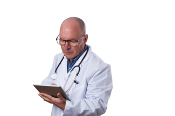 A medical professional in a white coat checks a tablet for patient details in a well-lit healthcare setting during daytime hours.