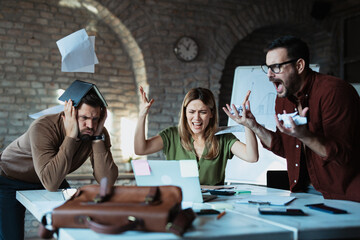 Frustrated business people having a bad day at work