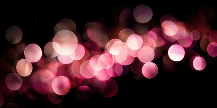 A soft, glowing lens flare in delicate hues of pink and white, creating a warm, almost nostalgic atmosphere against a stark black background, suitable for wedding or romantic themes
