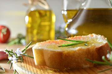 Detail of slice of bread seasoned with rosemary-essenced oil