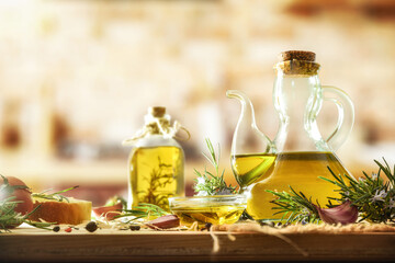 Containers with cooking oil with rosemary extract in kitchen