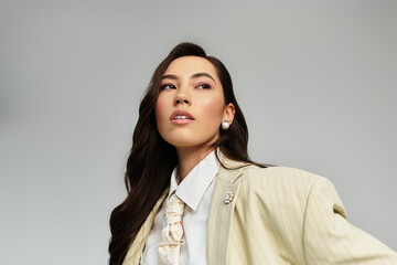 A beautiful young woman showcases her unique fashion sense in a trendy outfit, exuding elegance.