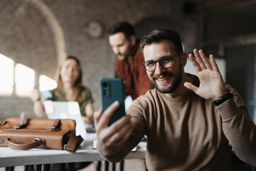Businessman have a video call via mobile in start up office
