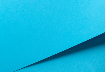 Scuba blue paper background with a smooth matte finish and bold geometric edges. Vibrant pastel tones and crisp contrasts create a polished, elegant, and contemporary design with a fresh, minimalistic