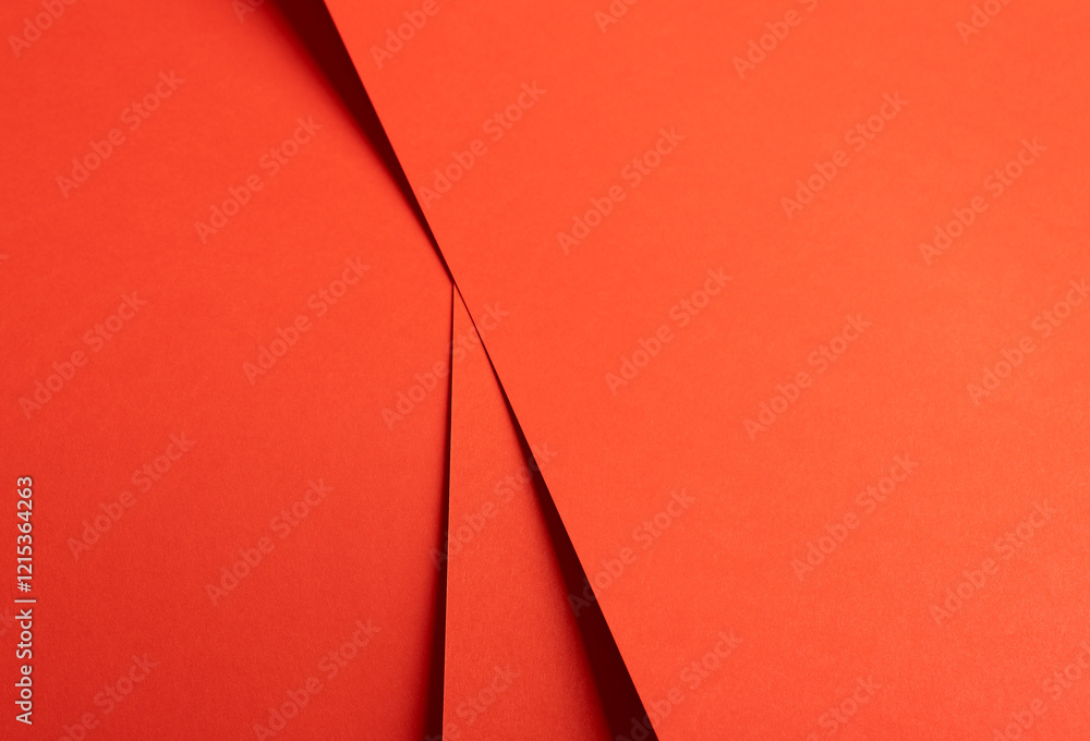 Poster red and orange paper background with a matte finish and sharp, layered angles. warm, vibrant tones a