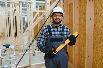 Construction of modular houses. Indian construction worker or engineer at construction site