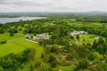 Aerial view of the gardens of Muckross House, furnished 19th-century mansion set among mountains and woodland in Killarney National Park, Ireland.